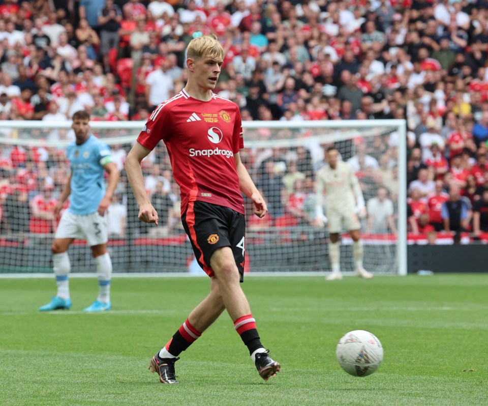 a soccer player wearing a snapdragon jersey kicks the ball