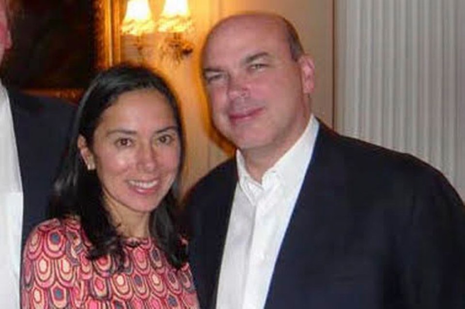 a man and a woman are posing for a picture together .