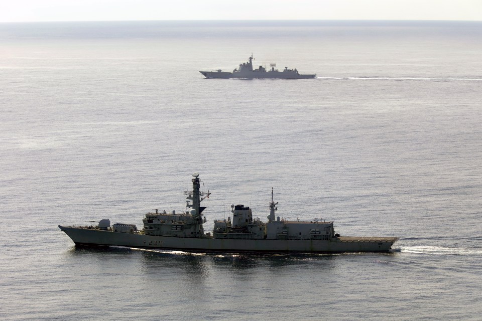 HMS Richmond (foreground) monitoring the Chinese destroyer Jiaozuo