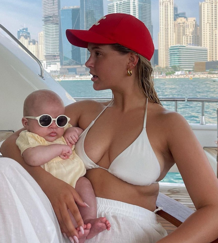 Molly pictured with their daughter on their family holiday to Dubai