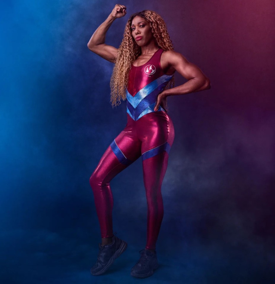 a woman in a superhero costume flexes her muscles