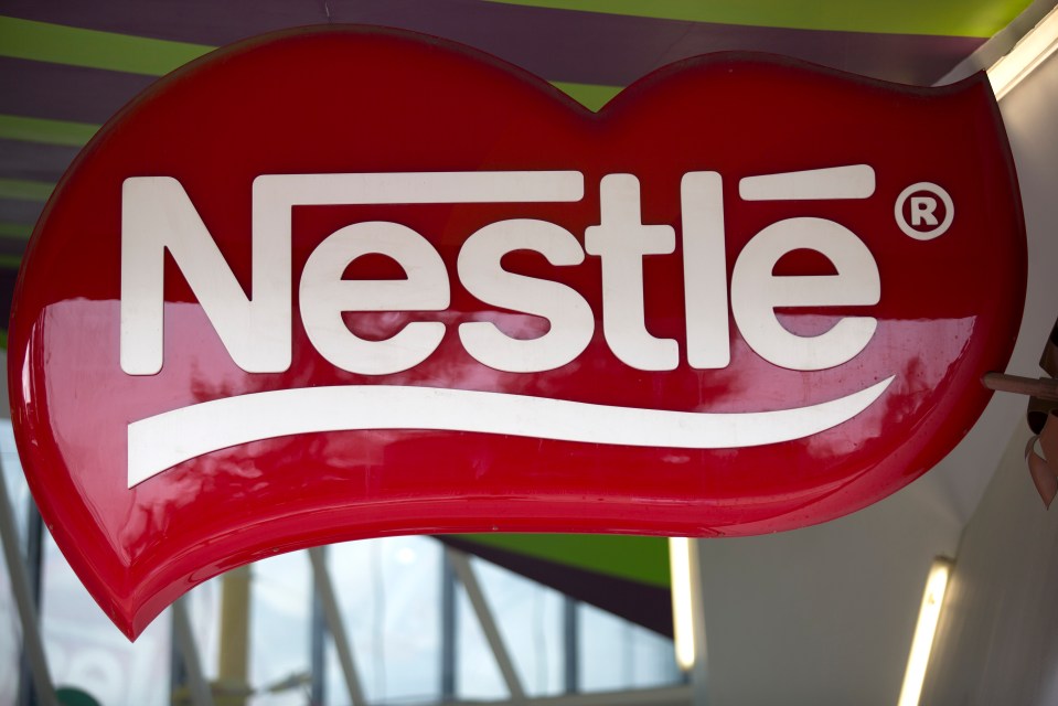 a red sign that says nestle on it