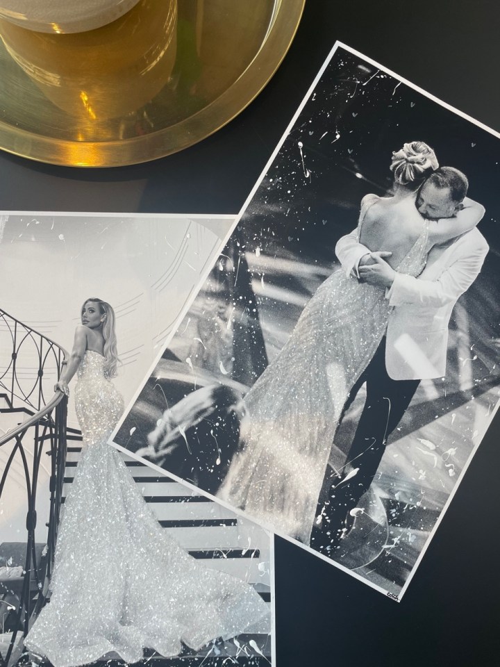 a black and white photo of a bride and groom