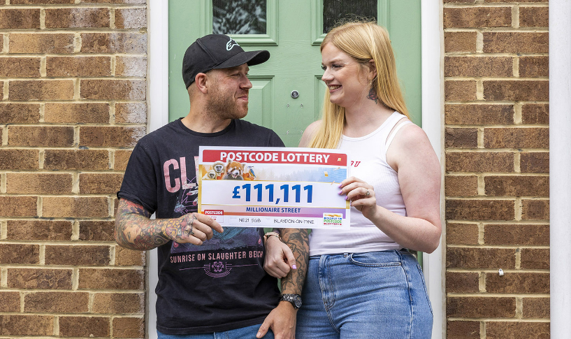 Christina and hubby Matthew outside the winning address