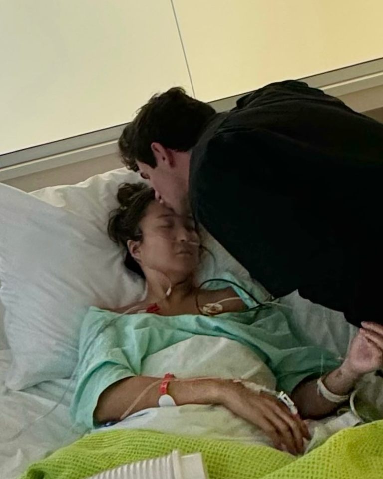 Paul tenderly kisses Ashley in her hospital bed during septic shock ordeal