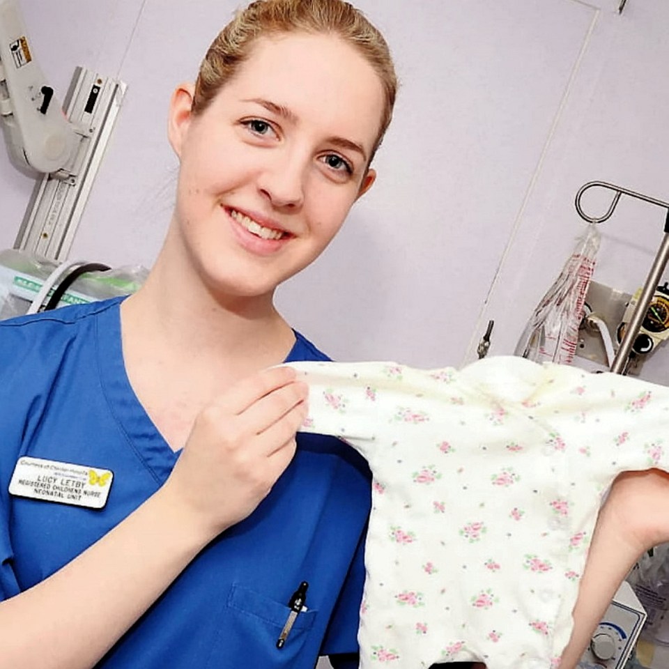 a woman in a blue scrub has a name tag that says stella