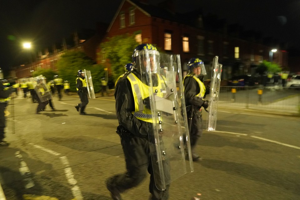 Police in riot suits tried to fend off crowds