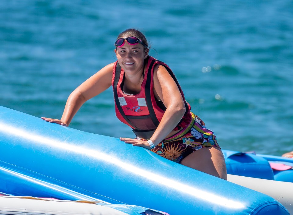 The EastEnders actress was having a blast playing on inflatables