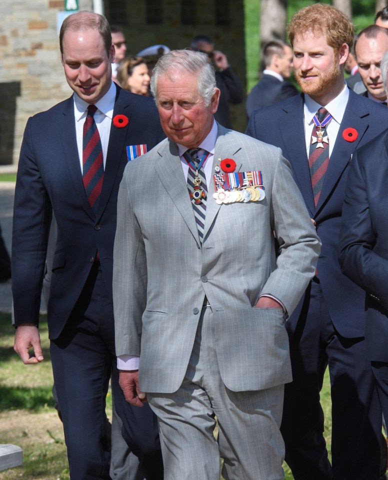 a group of men in suits and ties are walking together