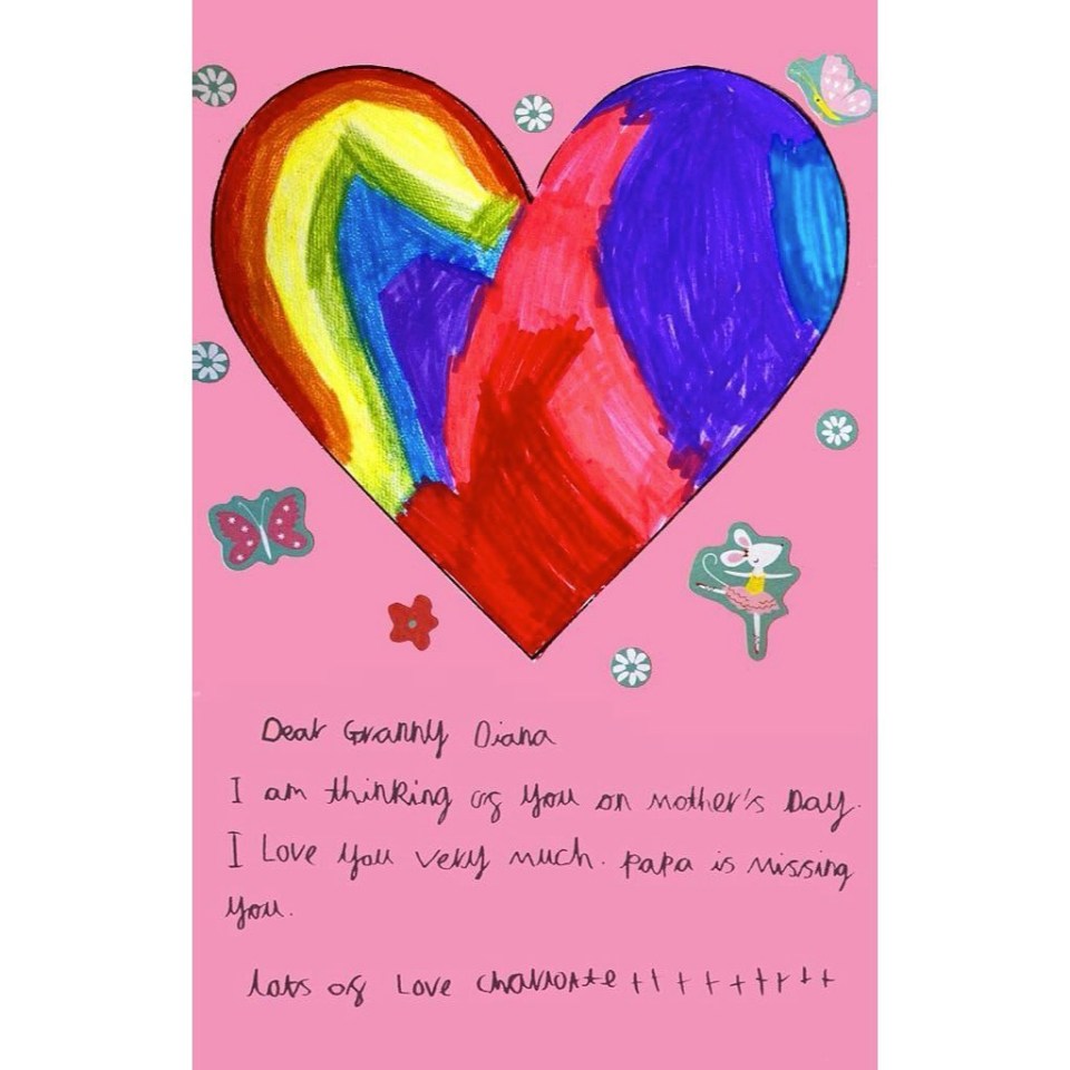 a child 's drawing of a colorful heart on a pink background