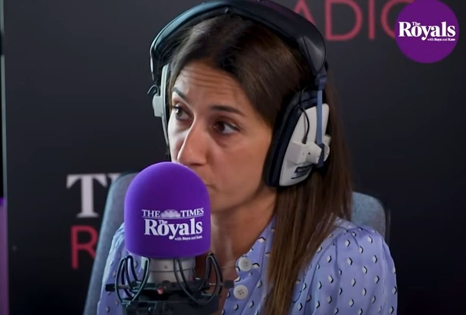 a woman wearing headphones and a purple microphone that says the times royals