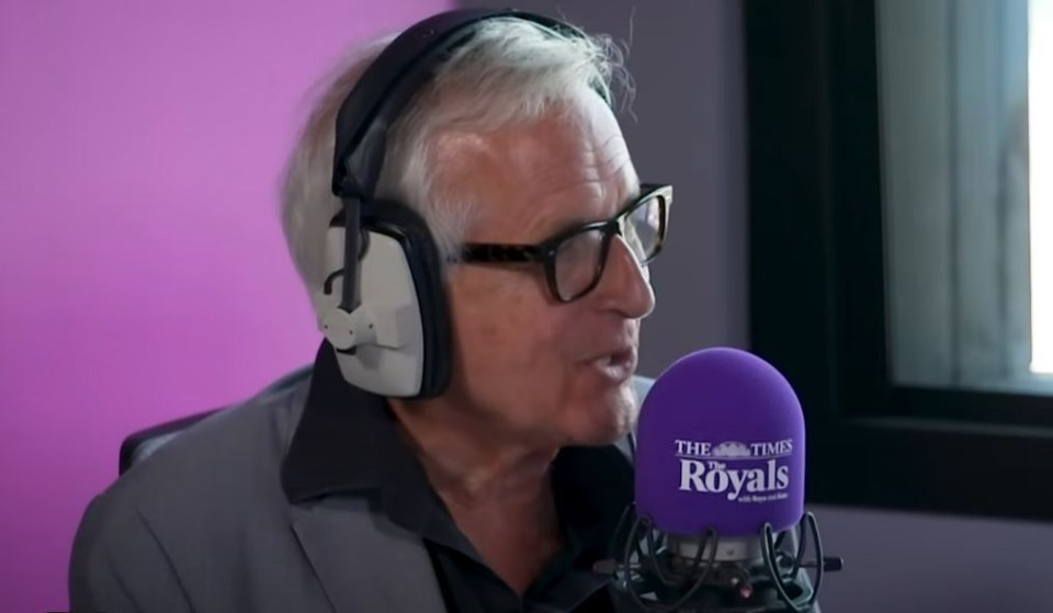 a man wearing headphones and a purple microphone that says the times royals