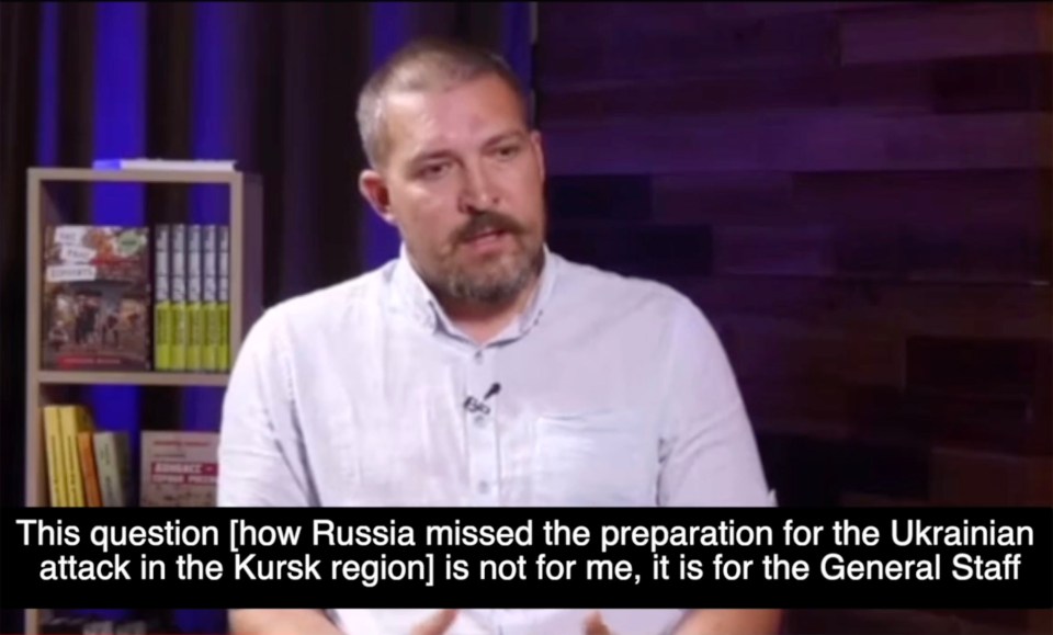 a man with a beard is talking about russia