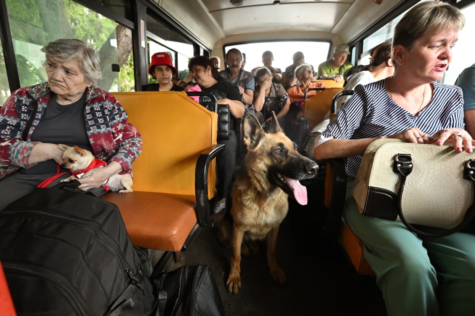 The situation in the Kursk region after the shelling of the Ukrainian Armed Forces. Evacuation of residents of the border areas of the Kursk region, injured as a result of the attack by the Ukrainian Armed Forces, at the evacuation point in the city of Rylsk. Genre photography. People on the bus. 09.08.2024 Russia, Kursk region, Kursk (Anatoliy Zhdanov/Kommersant/POLARIS)