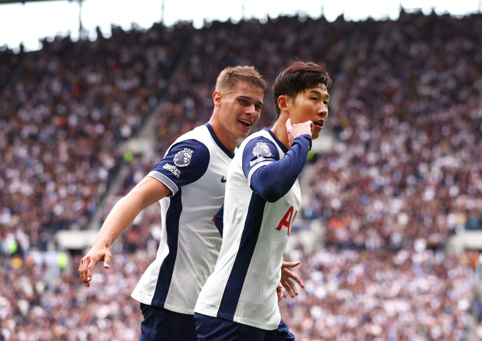 two soccer players one of whom has the letter a on his jersey