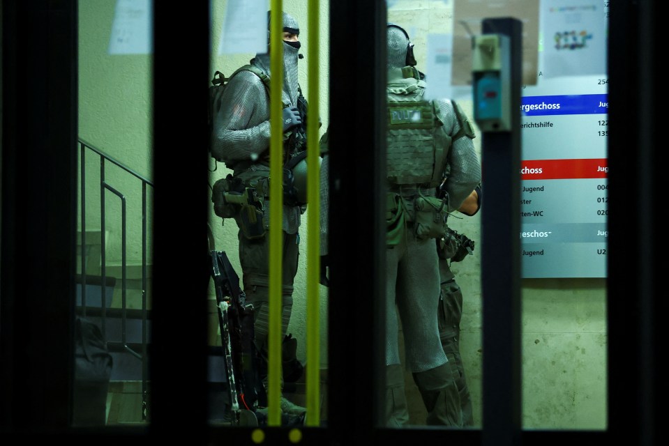 two soldiers are standing in front of a sign that says chass