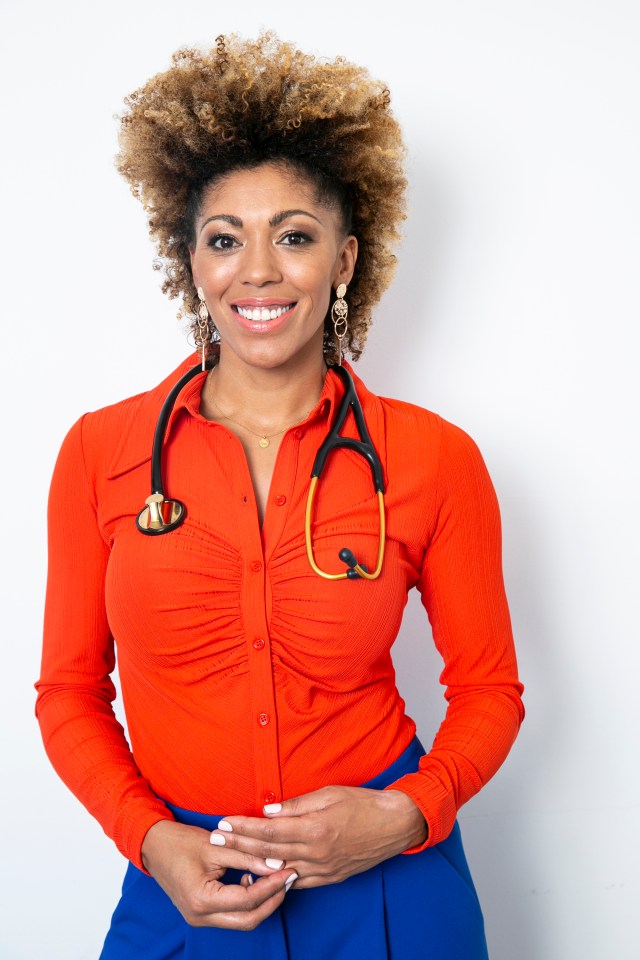 a woman wearing an orange shirt with a stethoscope around her neck