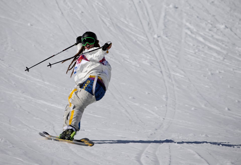 a skier wearing a jacket that says sw on it