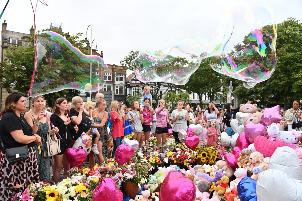 Tearful well-wishers embraced outside Southport’s Atkinson Theatre where many left cards, flowers, stuffed toys and balloons