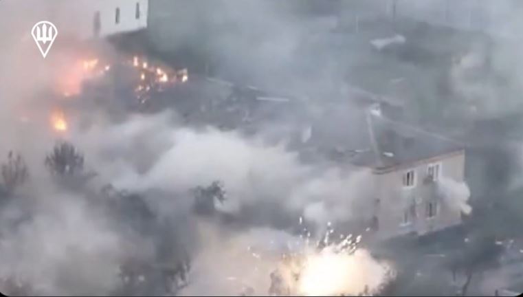 Plumes of smoke can be seen rising from houses as fires rage