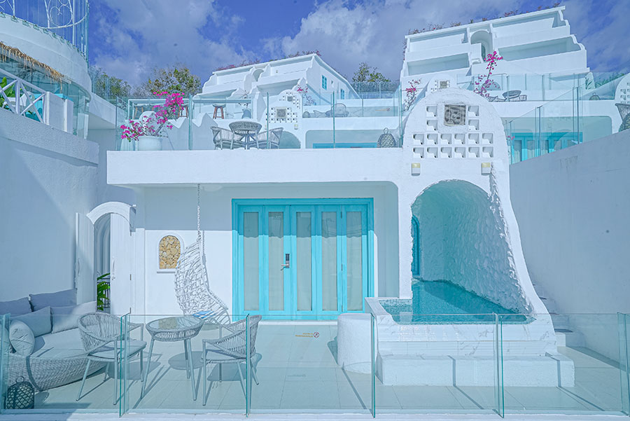 The resort has the famous whitewashed walls and blue doors