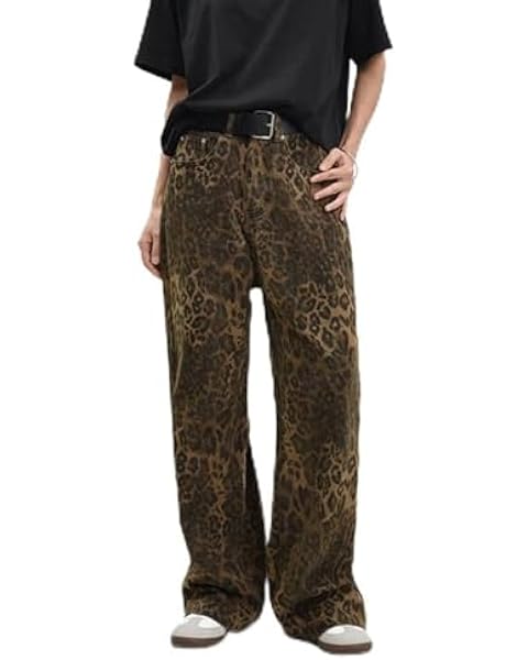 a person wearing a black shirt and leopard print pants .