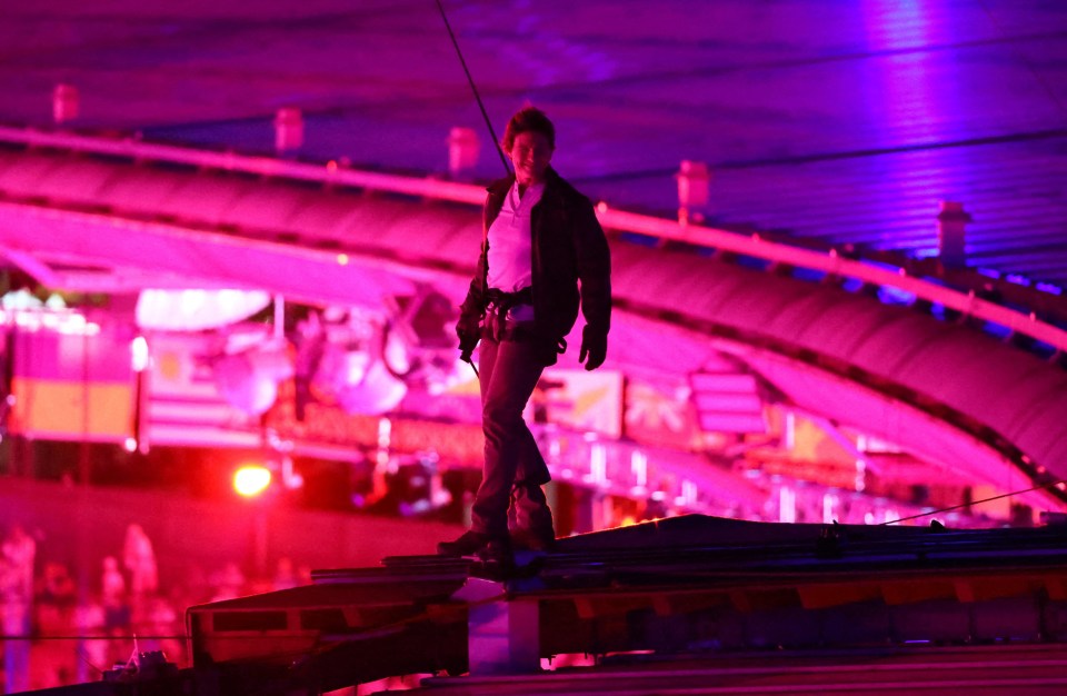 He descended the massive distance between the stadium roof and the athletics track