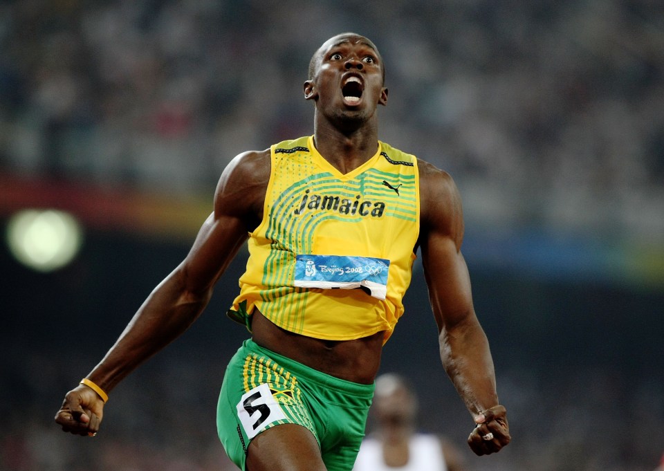 a man in a jamaica jersey with the number 5 on his shorts