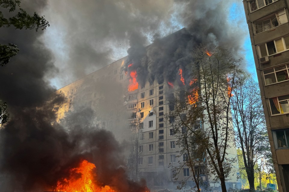 Thick black smoke poured out of the apartment building in Kharkiv