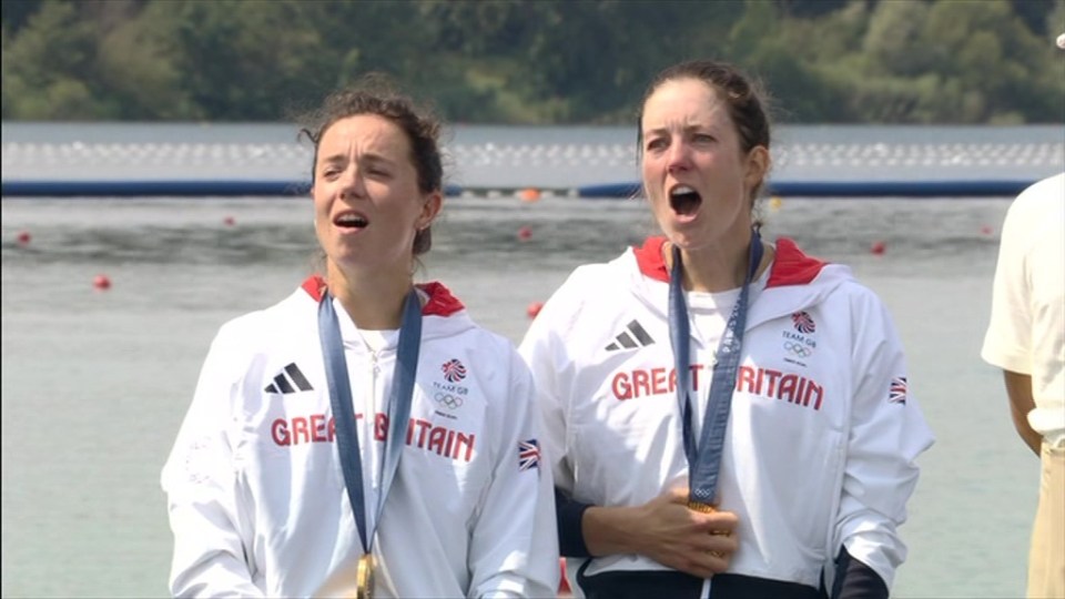 The historic duo embraced the atmosphere as they sang the national anthem