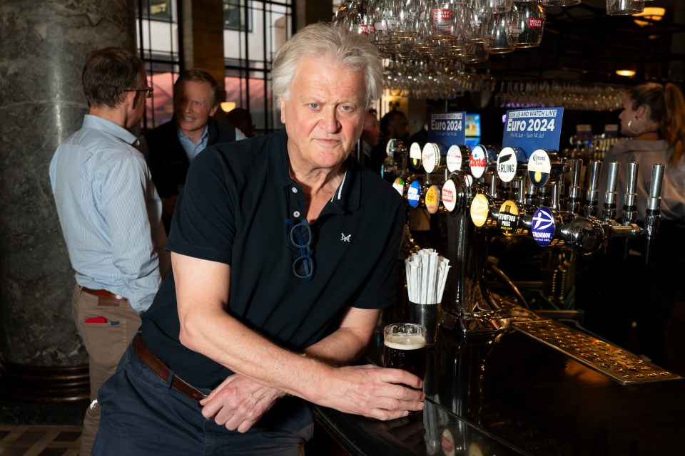 a man leans on a bar with a sign that says euro 2024