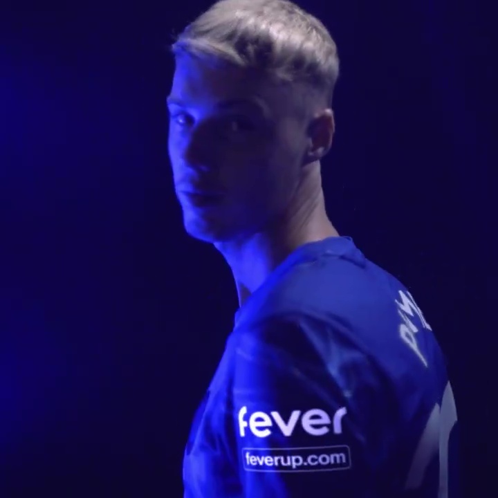 a man wearing a blue shirt with the word fever on it