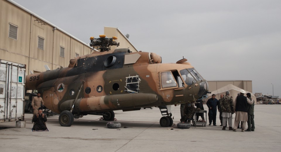 a military helicopter with the number 395 on the side