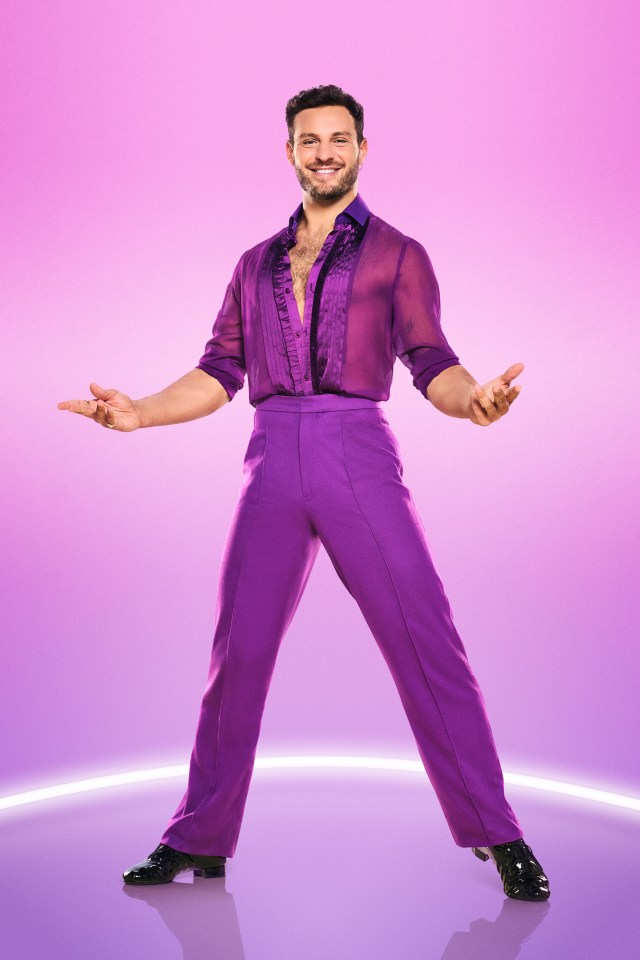 a man in purple pants and a purple shirt is dancing