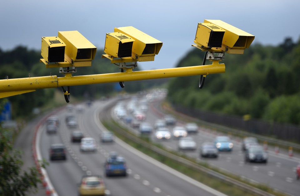 a highway with a bunch of cars going down it