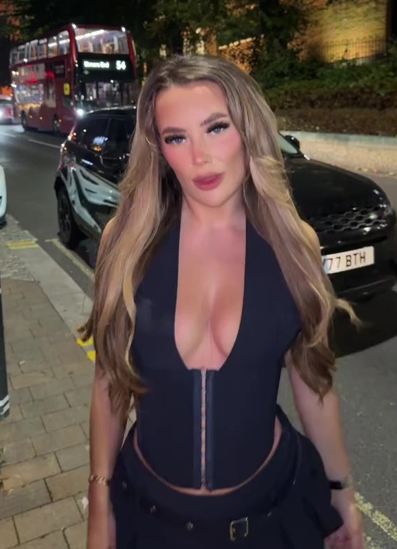 Harriett Blackmore flashed her cleavage in a plunging top