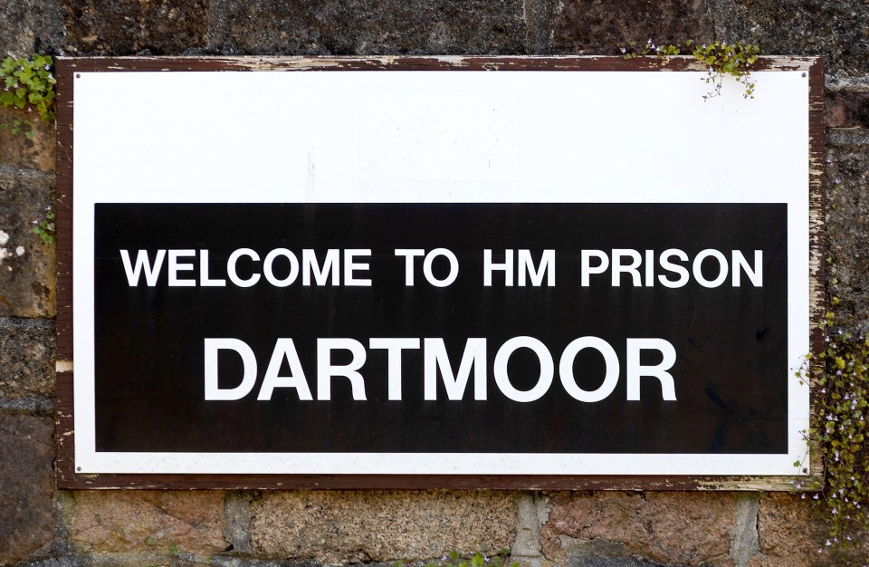 a sign that says welcome to hm prison dartmoor