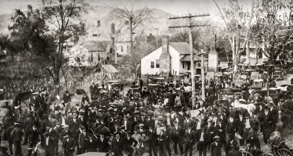 a black and white photo of a crowd of people