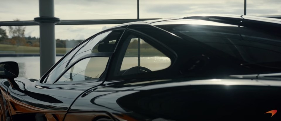 a black car with a mclaren logo on the side