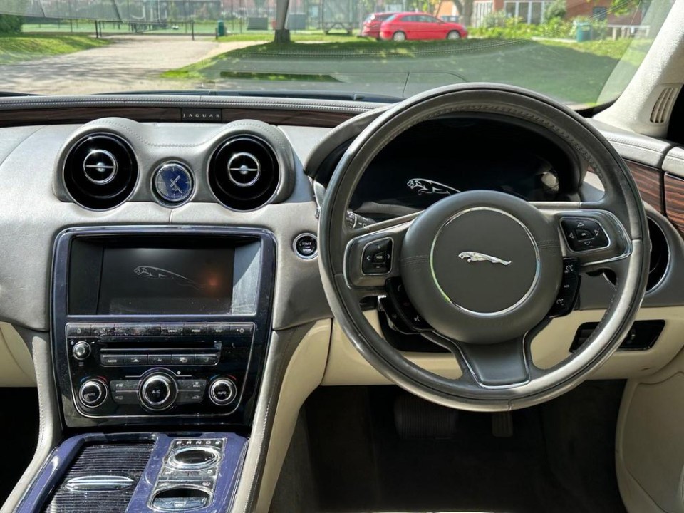 the interior of a jaguar car with a steering wheel