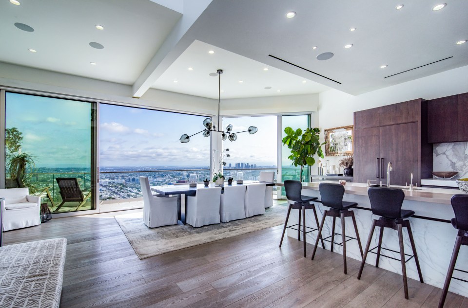 It features panoramic views of the LA skyline and a wrap around terrace