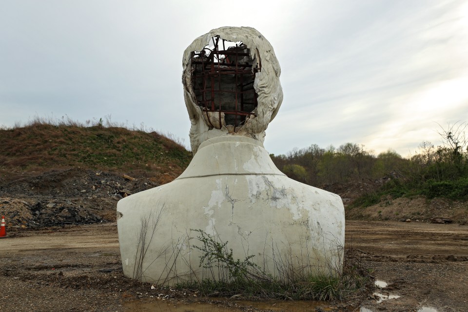 a large statue with a hole in the middle of it