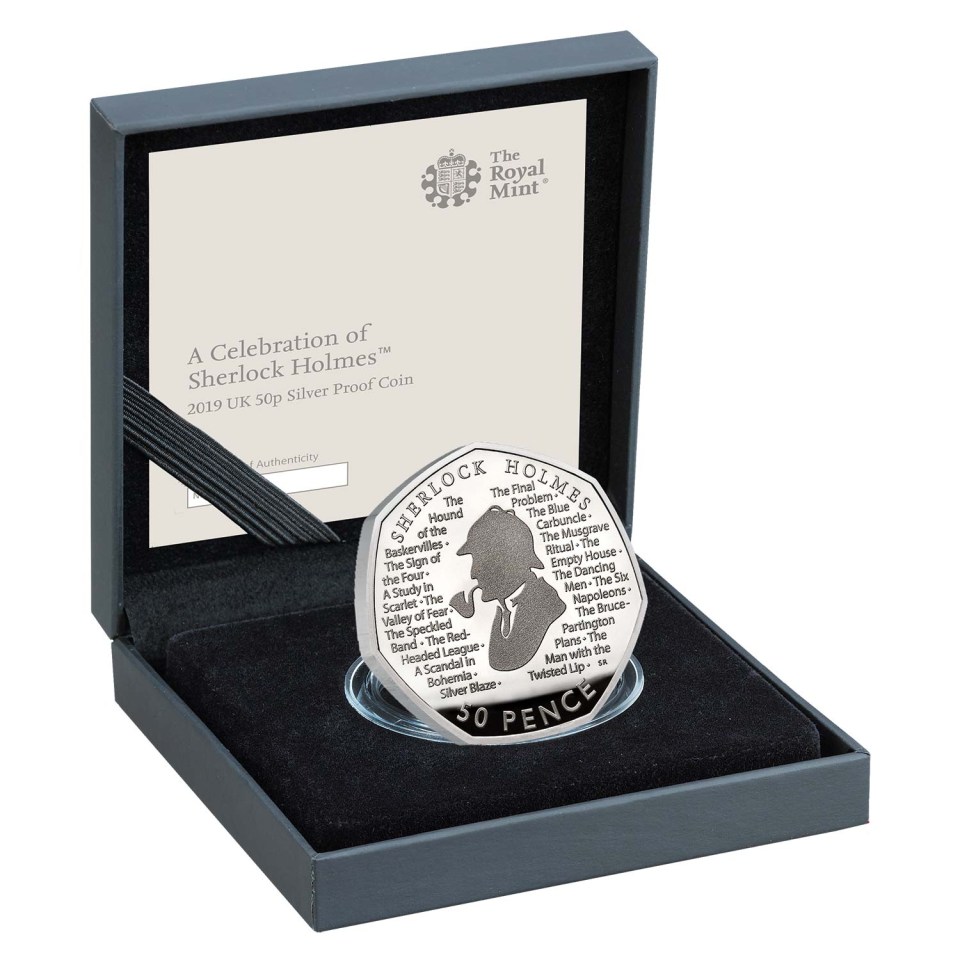 a coin in a box that says sherlock holmes on it