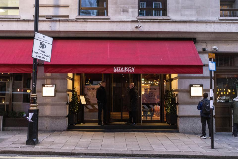 The former UFC champion, 36, handed out wads of $100 notes to staff at posh Novikov