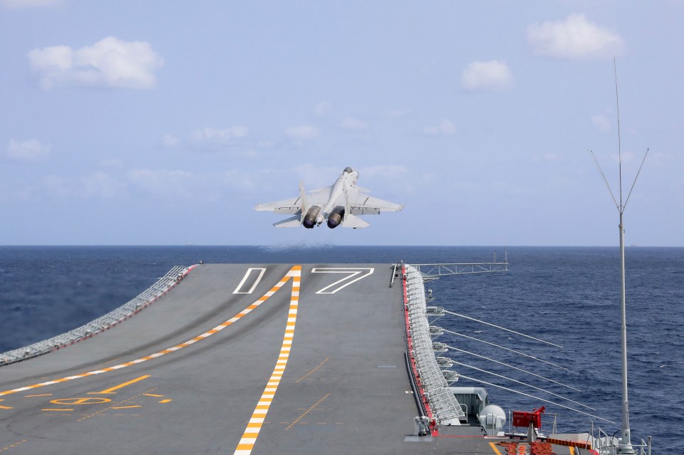 A J-15 Chinese fighter jet takes off from an aircraft carrier