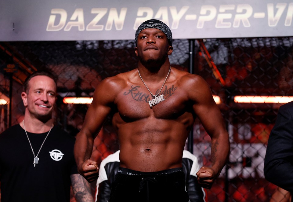 a man stands in front of a sign that says dazn pay-per-view