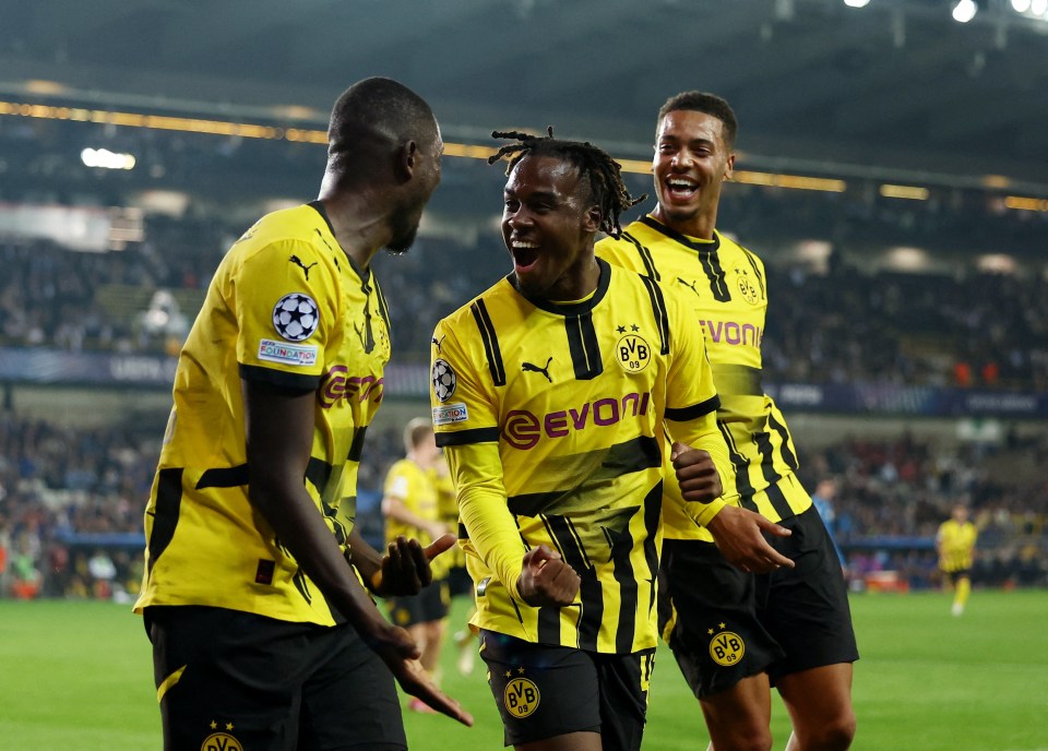 Serhou Guirassy celebrates his late penalty with Gittens and Felix Nmecha