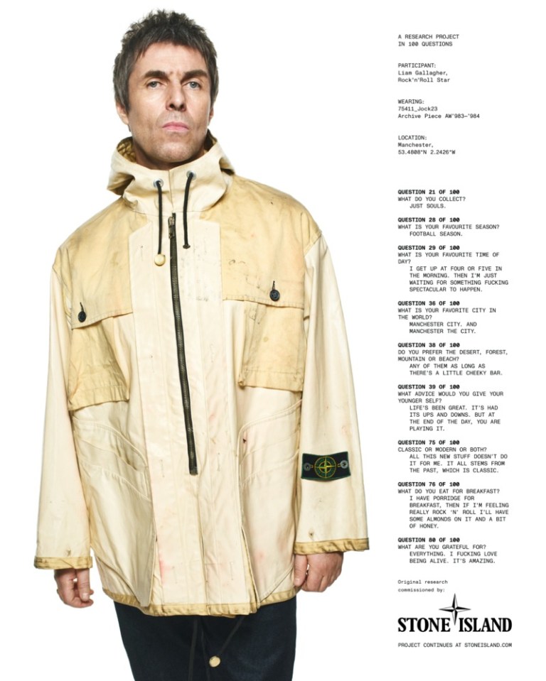 a man wearing a white stone island jacket