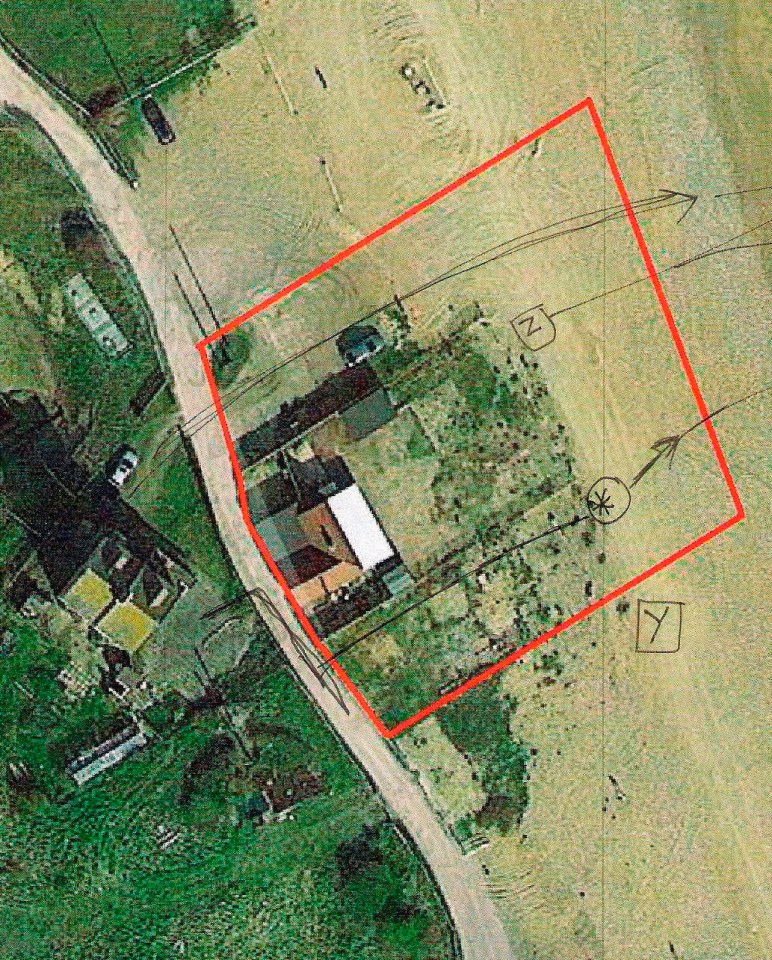 an aerial view of a house with a red outline around it