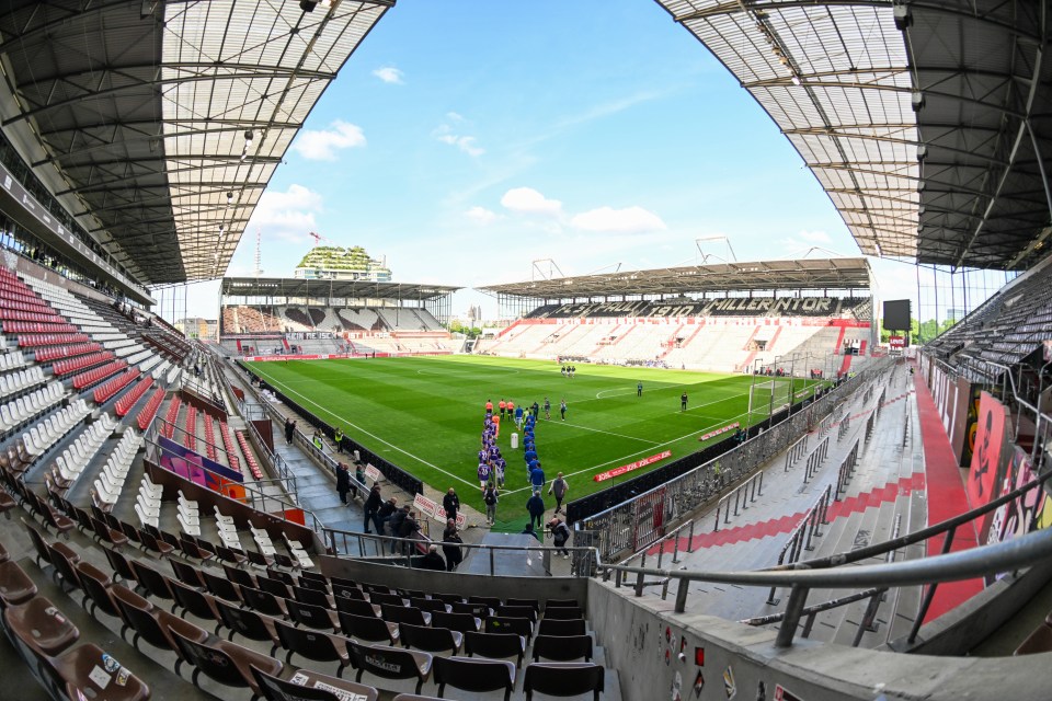 a soccer stadium with a sign that says ' allianz ' on it